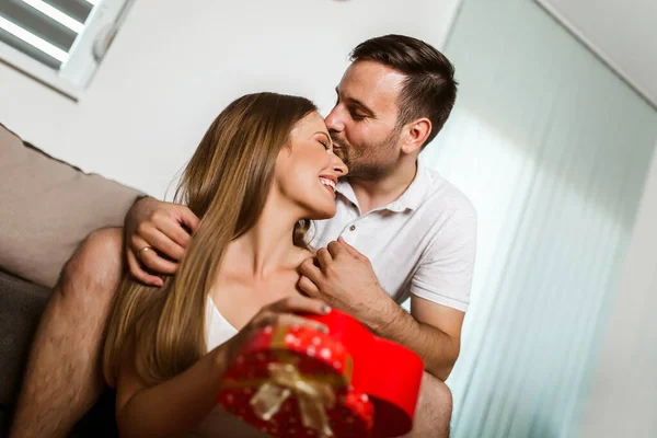 Charming Woman Accepting Present Husband Home — Stock Photo, Image