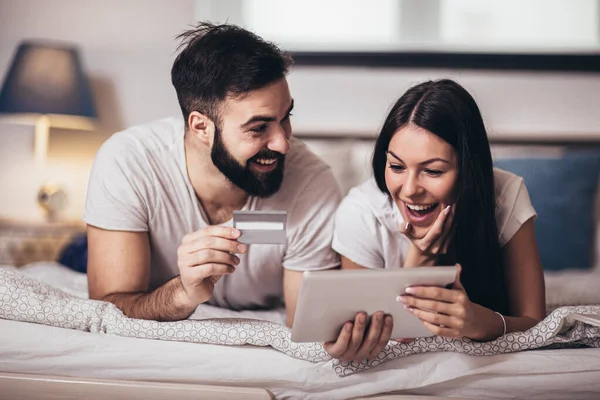 Lovely Young Happy Couple Laying Bed Shopping Online Credit Card — 스톡 사진