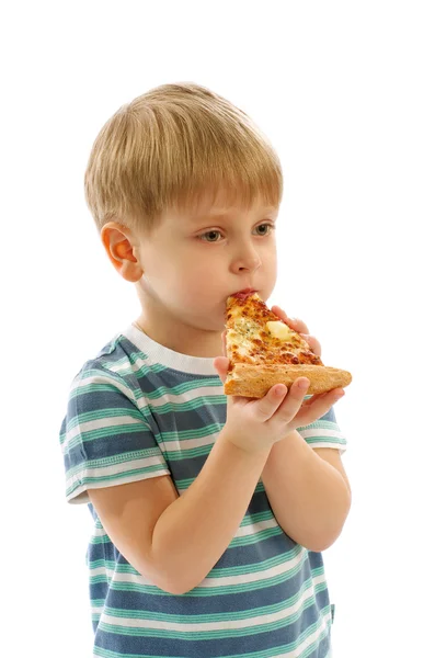 Niño comiendo pizza — Foto de Stock