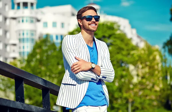 High fashion look.Young stylish confident happy handsome  businessman model man in blue suit cloth lifestyle in the street in sunglasses — Stock Photo, Image