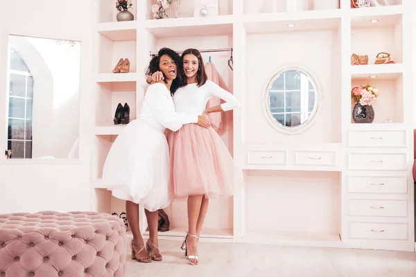 stock image Two young beautiful smiling international hipster female in trendy summer dresses. Sexy carefree women posing in pink wardrobe. Positive models having fun. Concept of friendship 