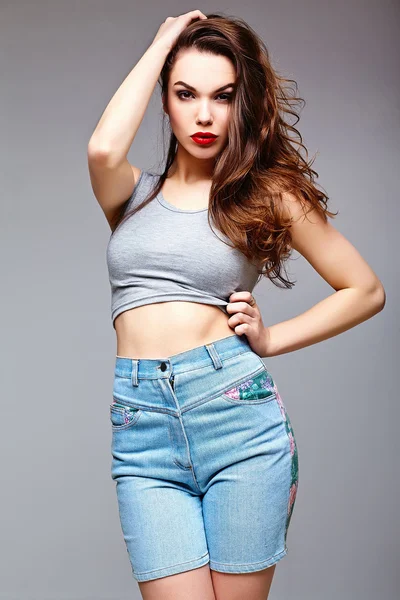 High fashion look.glamor stylish sexy surprised beautiful young woman model in summer bright jeans  hipster cloth — Stock Photo, Image