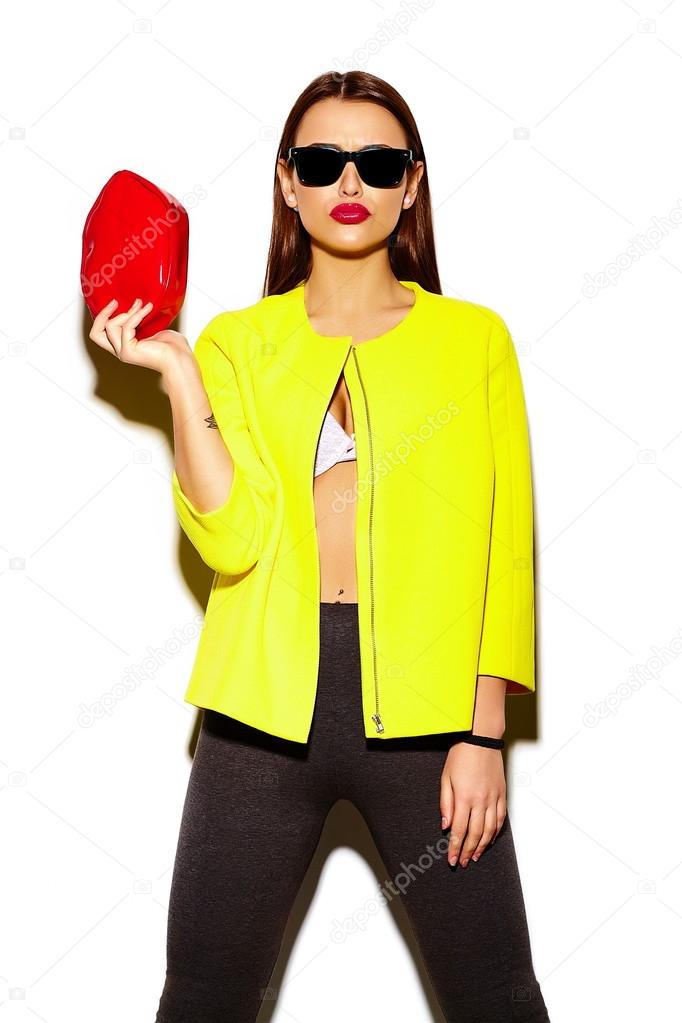 High fashion look.glamor stylish sexy smiling beautiful young woman model in summer bright casual  hipster cloth in yellow coat