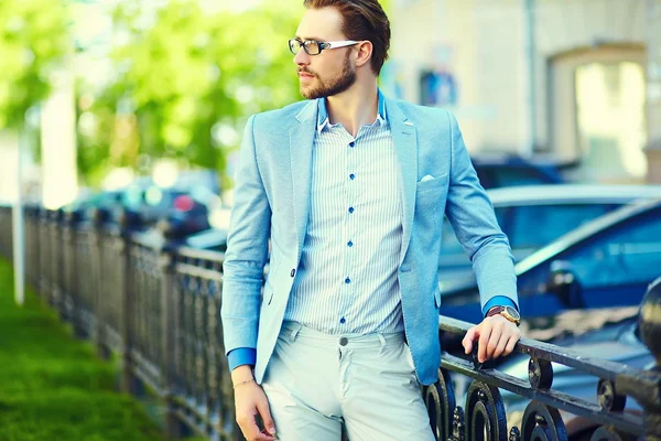 High fashion look.Young stylish confident happy handsome businessman model  in suit cloth lifestyle in the street in sunglasses — Stock Photo, Image