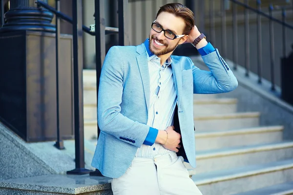 High fashion look.Young stylish confident happy handsome businessman model  in suit cloth lifestyle in the street in sunglasses — Stock Photo, Image