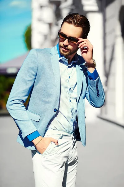 High fashion look.Young stylish confident happy handsome businessman model  in suit cloth lifestyle in the street in sunglasses — Stock Photo, Image