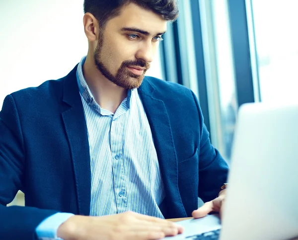 Young fashion handsome smiling hipster man  in the city cafe during lunch time with notebook in suit — Stock Photo, Image