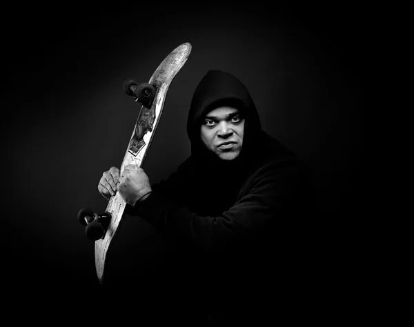 Young man with skateboard — Stock Photo, Image