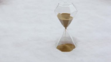 footage of sand clock snow background