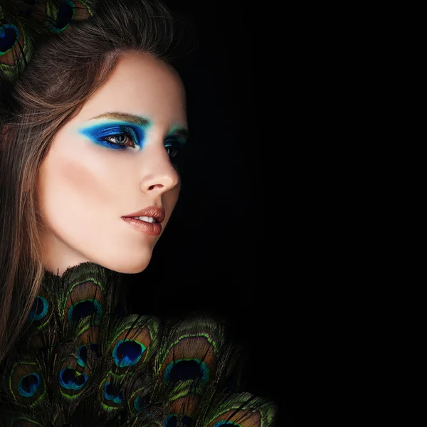 Glamorous Woman with Makeup and Peacock Feathers on Black Backgr — Stock Photo, Image