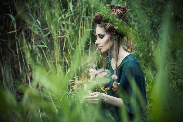 Beautiful woman in green grass