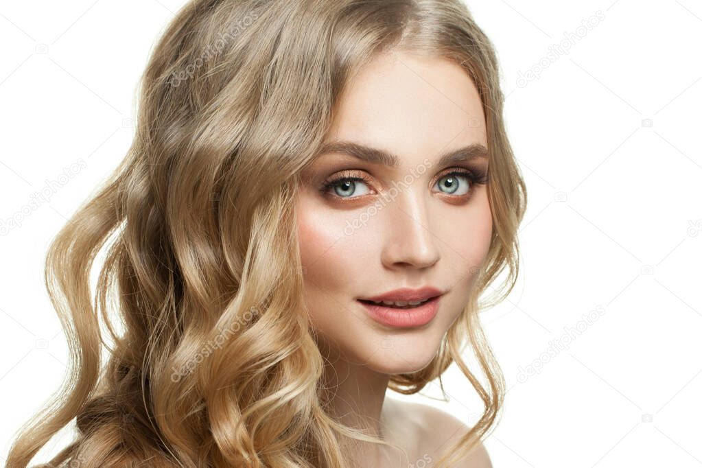 Beautiful woman face on white. Model with blonde hair and natural makeup