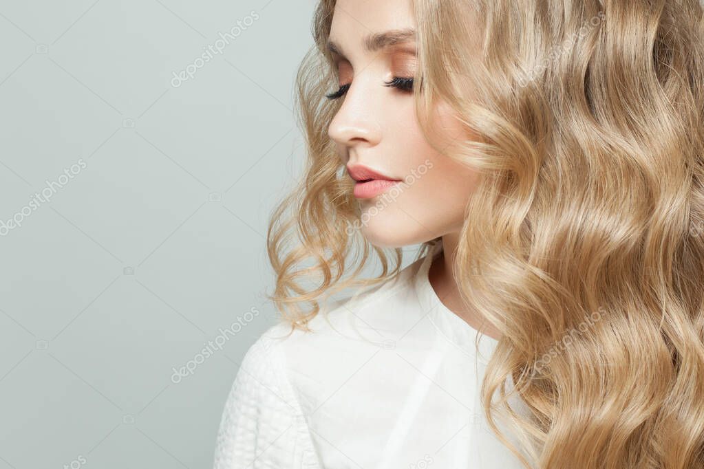 Elegant woman with blonde curly hair