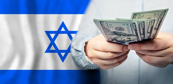 以色列的政治 商业和社会问题概念 具有犹太国旗背景的美元现钞 — 图库照片