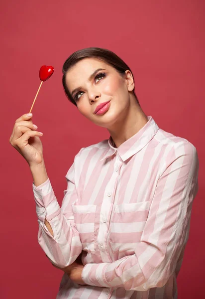 Red Heart Symbol Valentines Day Smiling Woman Hold Red Background — Stockfoto