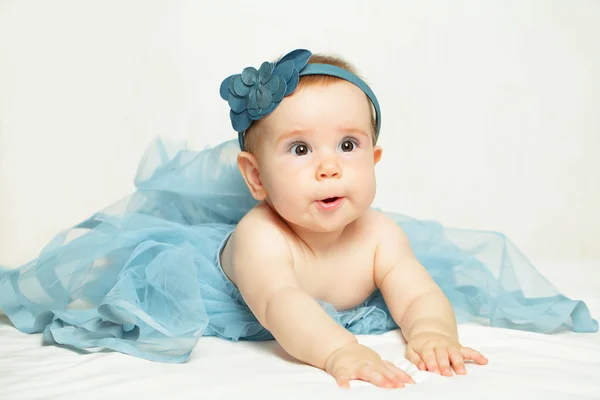 Beautiful little girl in blue dress — Stock Photo, Image