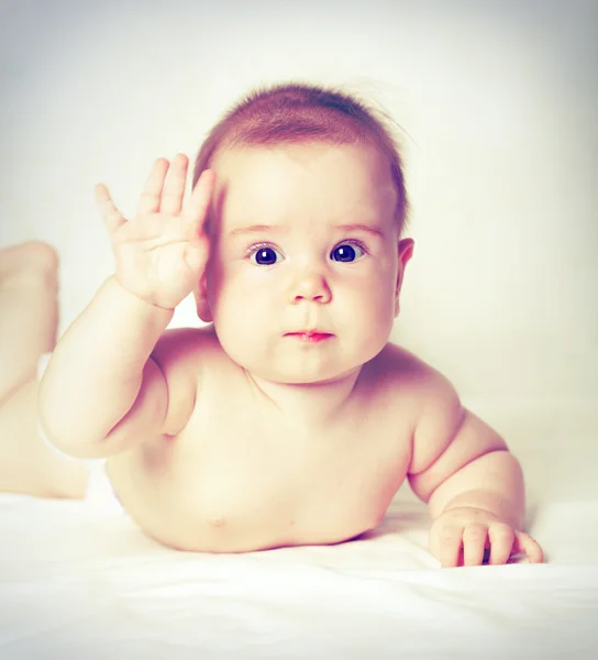 Baby with hand up — Stock Photo, Image