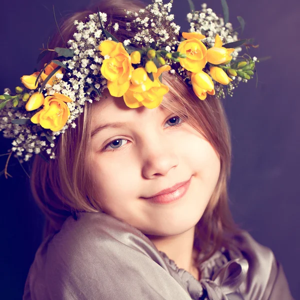 Joyful child girl with yellow flowers — Stock Photo, Image