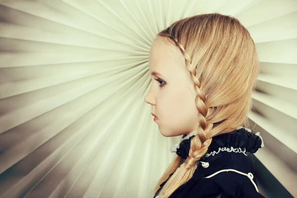 Girl with braids of blond hair, fine art portrait — Stock Photo, Image