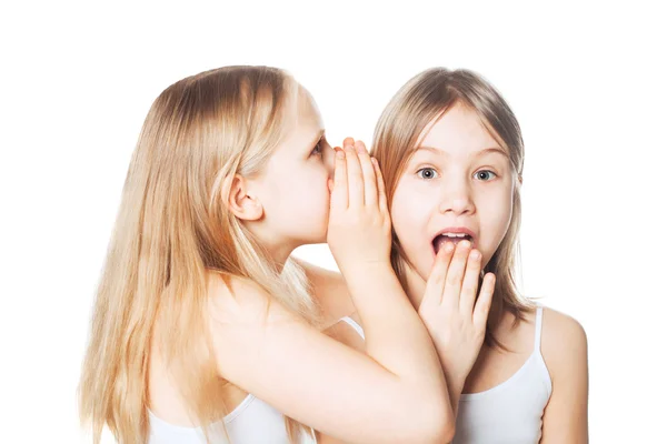 Gossip. Woman whispers to the friend secrets — Stock Photo, Image