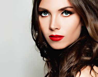 Beauty Girl. Woman with Makeup and Curly Hair. Fashion Backgroun