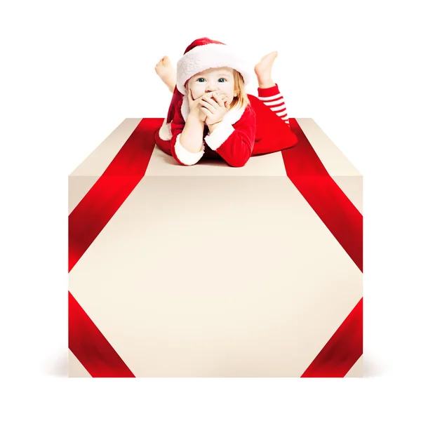 Christmas. Xmas Child lie on Big Gift Box White Background — Stock Photo, Image