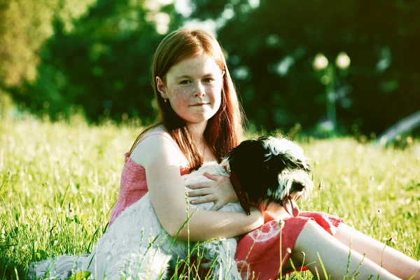 Cute redhead girl with dog — Stock Photo, Image