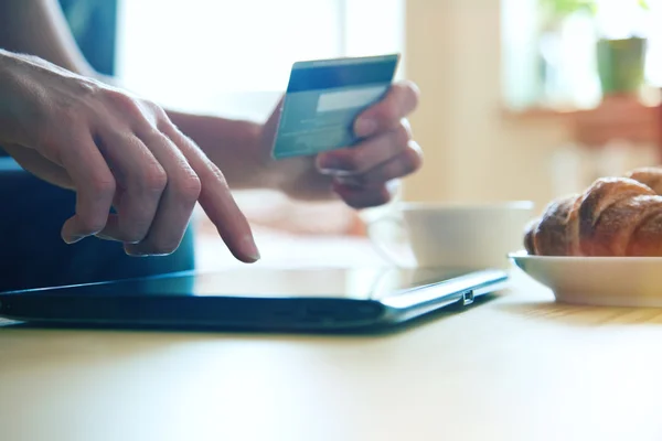 Hands holding credit card and using digital tablet pc — Stock Photo, Image