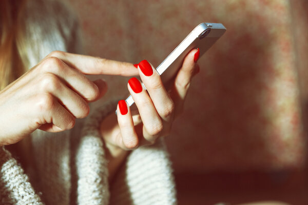 hands with smartphone touching screen