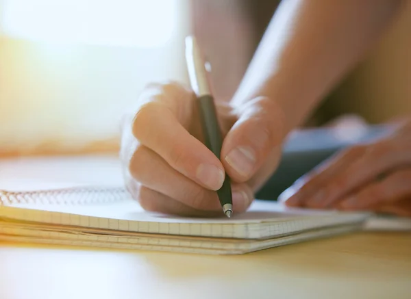 Female hands with pen — Stock Photo, Image