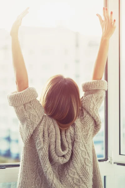 Woman raising hands — Stock Photo, Image