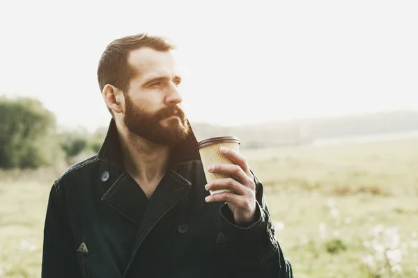 Bearded man with paper cup — Stock Photo, Image