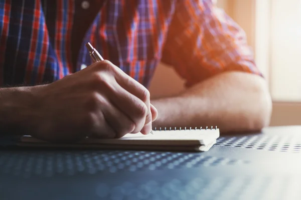 Writing in notebook with pen — Stock Photo, Image