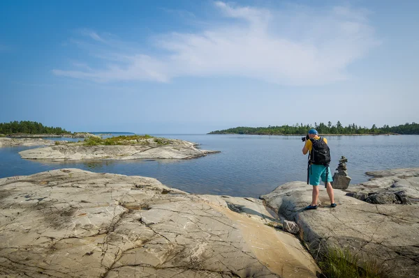 Photographer at Karelia republic islands. — Stock Photo, Image