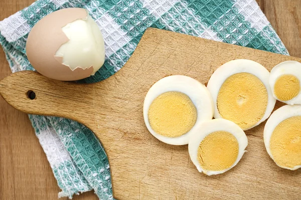 Boiled egg sliced on the board — Stock Photo, Image