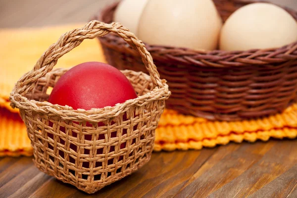 Easter eggs in wicker basket — Stock Photo, Image