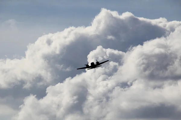 Plane Exits Cumulus Clouds — Stock Photo, Image