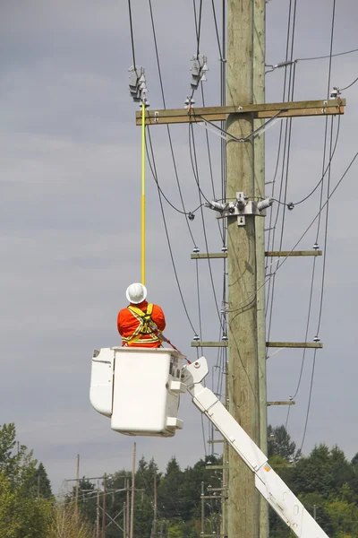 Linesman Retrieving Wireless Current Sensor — Stock Photo, Image