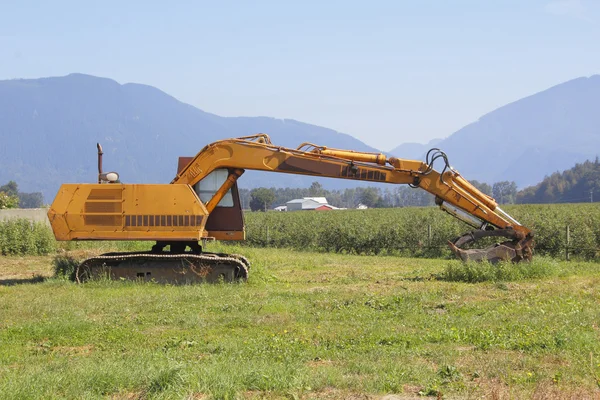 Industrial Equipment and a Farm — Stock Photo, Image