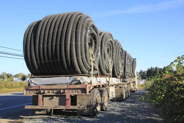 Flexible hose or duct on a double flatbed — Stock Photo, Image