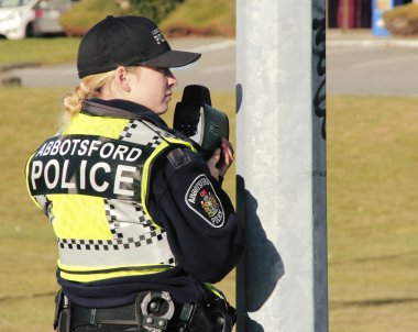 Canadian Police Officer with Radar Gun clipart