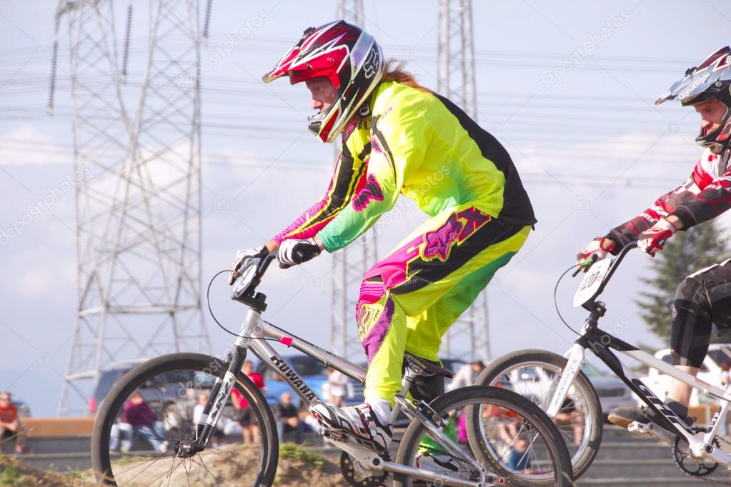 Profile medium close up of a BMX'er racing in a local competition in Abbotsford, British Columbia on June 4, 2014.