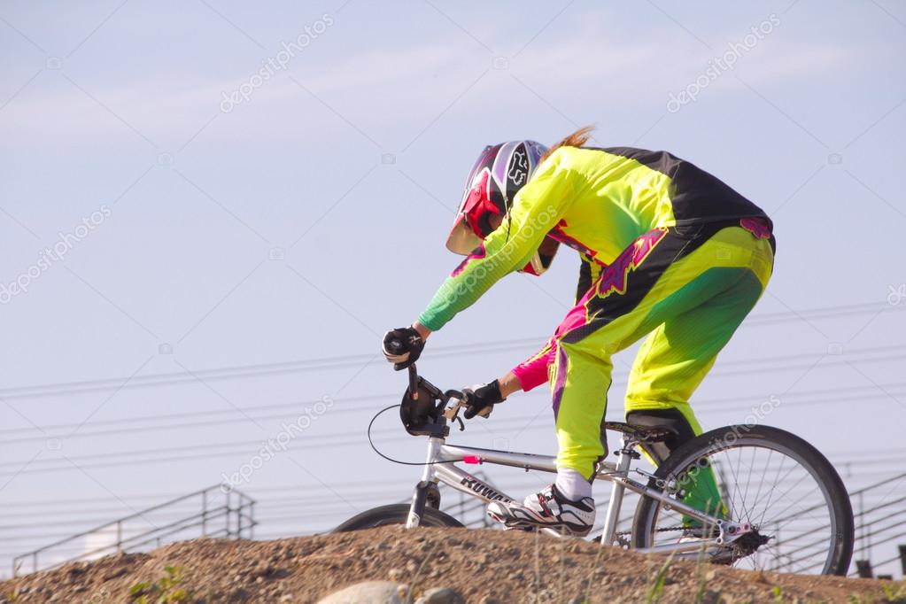 Three quarter profile of a BMXer in a local competition in Abbotsford, British Columbia on June 4, 2014.