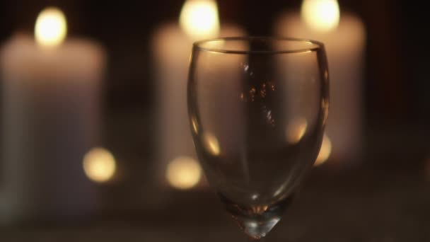 Blood Dripping Into Empty Candle Lit Wineglass — Stock Video
