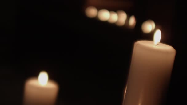 Eerie Wind Blowing Out Candles In Dark — Stock Video