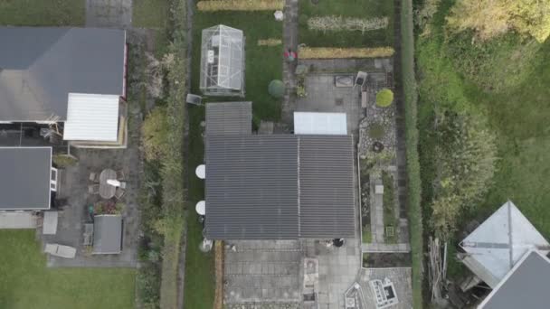 Drone Rising Over Lone Man Walking From House — Stockvideo