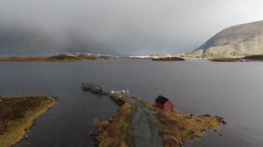 Drone Over Hut with Rainbow Over Fijord