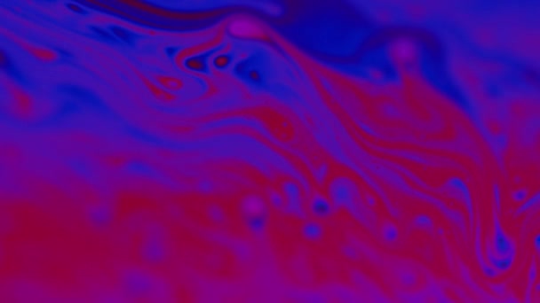 Swirling Motion Macro Shot of Liquid Solution in Color — Stock Video