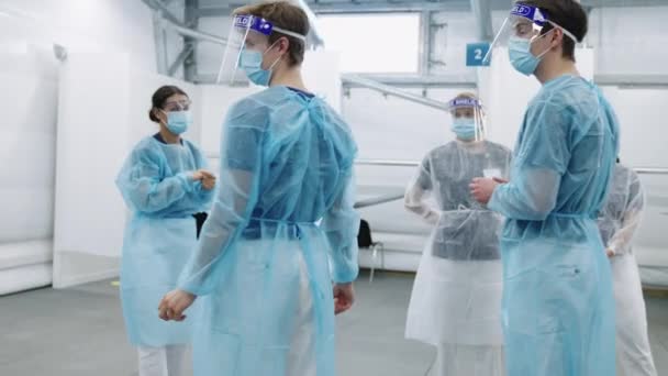 Young Doctors And Nurses In Scrubs And Masks — Stock Video