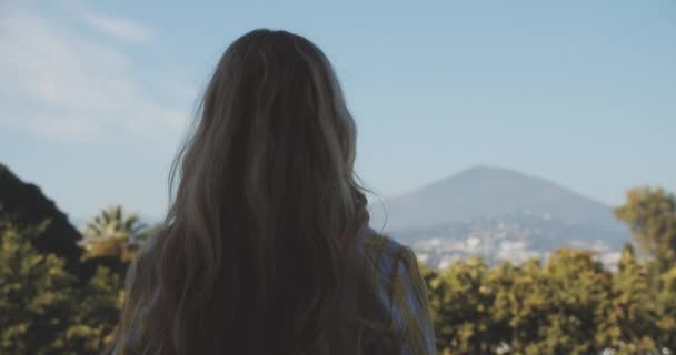 Woman's Back Against Camera Standing by the Porch Admiring the View — Vídeo de Stock